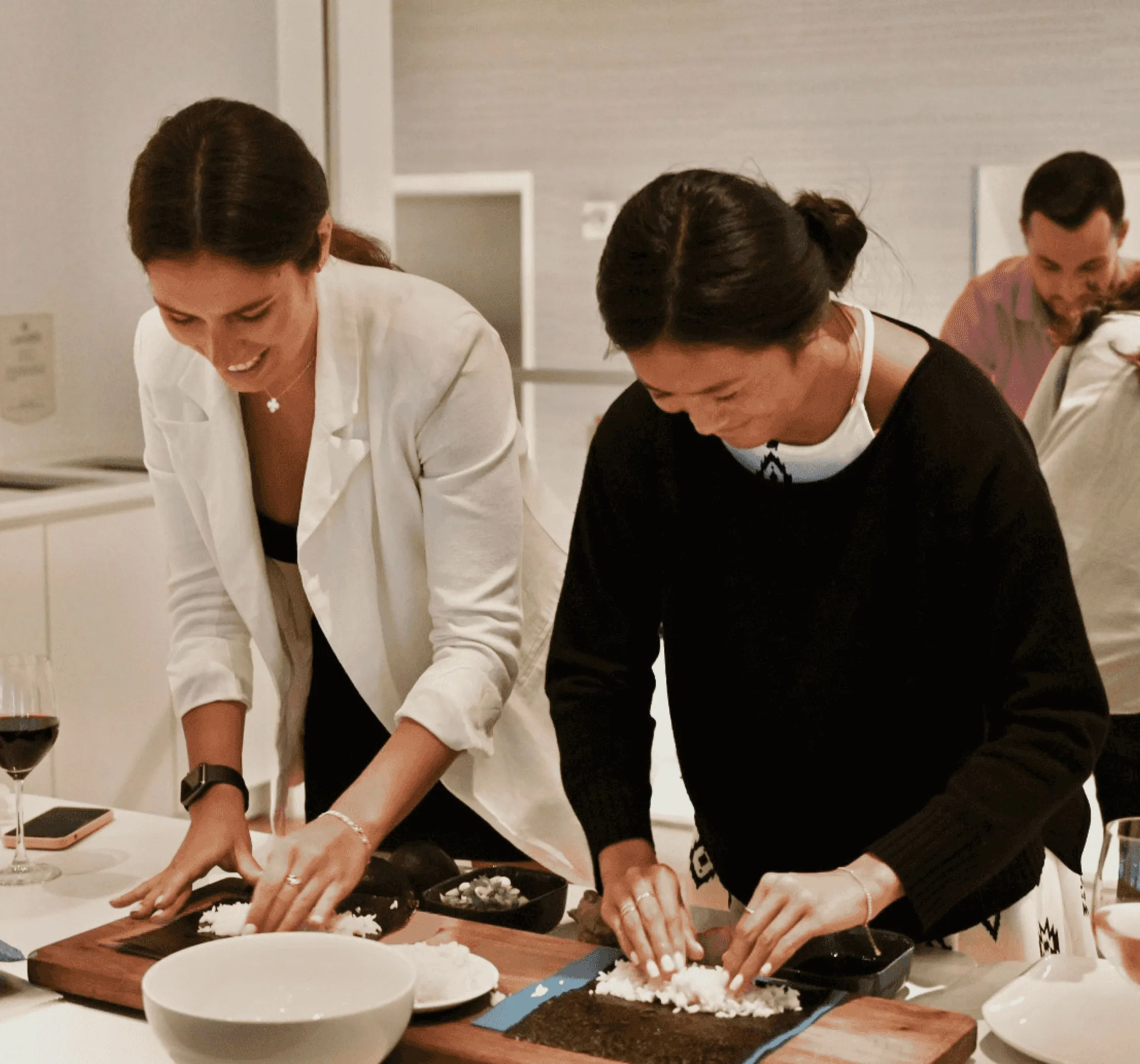 Women attending a sushi class event at 151 West 42nd