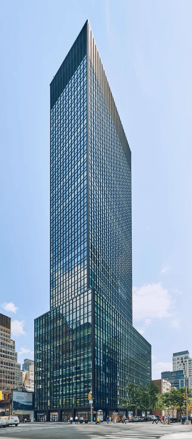 825 Third Ave—A sleek office tower in New York City, towering over the skyline with modern architecture and glass windows.